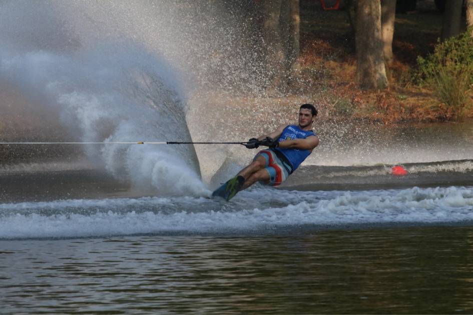 A slalom skier crosses the wake.
