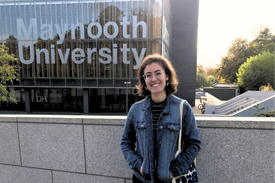 Rollins student in front of the Maynooth University library.