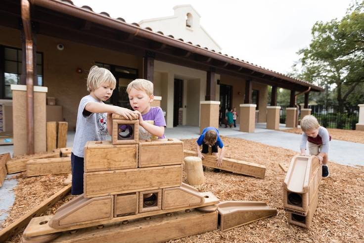 Students playing on the playground at the Child Development & Student Research Center at Rollins College.