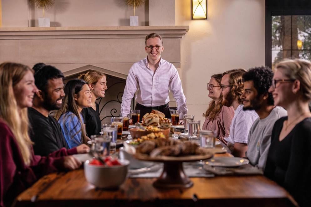 Joseph Pool leads a Breaking Bread shared meal