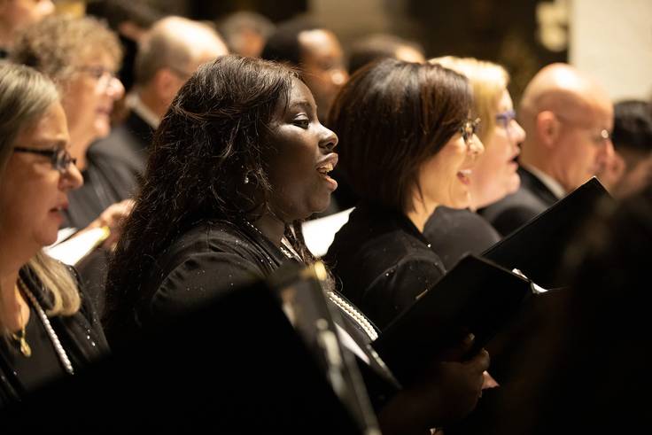 Rollins choir students sing during a performance