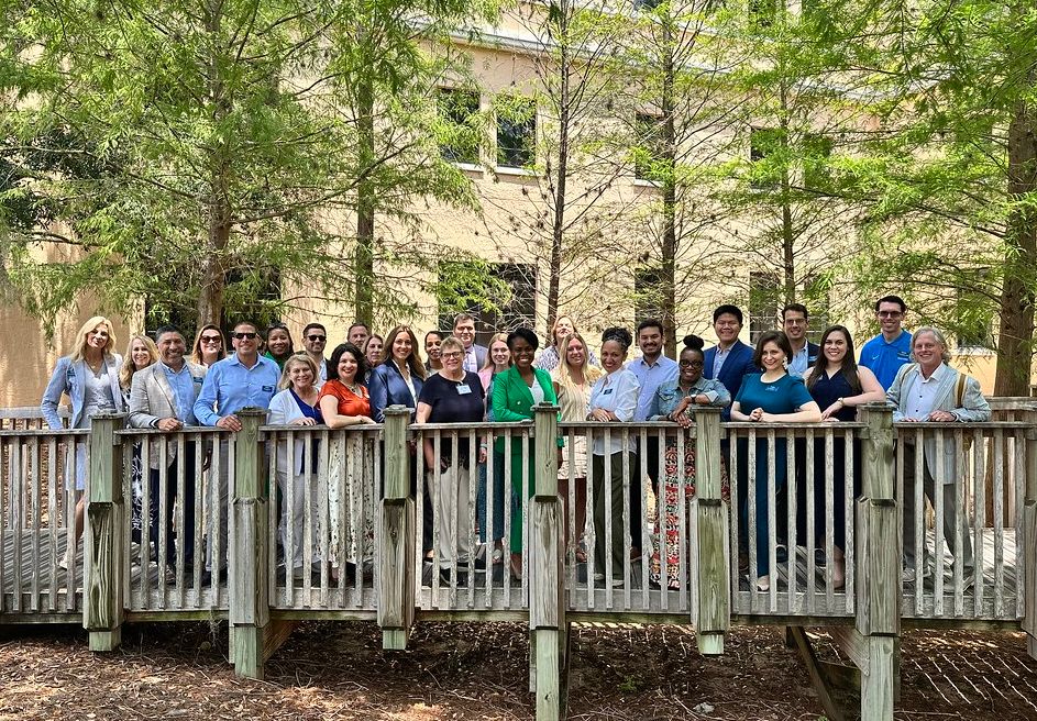 The Executive Committee of the alumni board, outside on the lawn at Rollins College