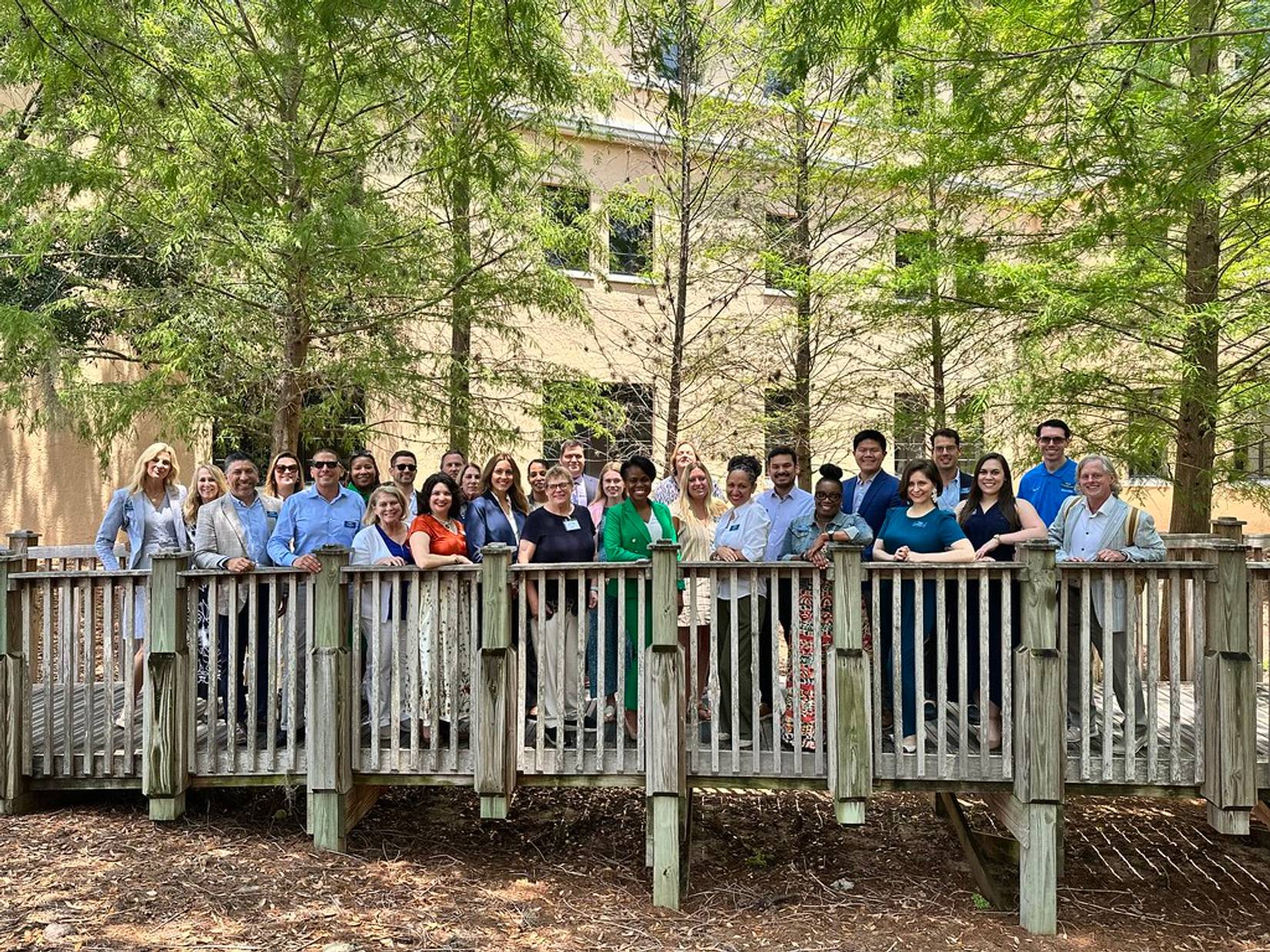 Outdoor group photo of the Rollins Alumni Advisory Board.