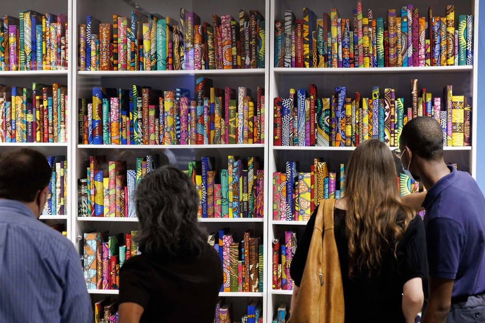 Guests take in brightly colored volumes highlighting stories from the Great Migration.