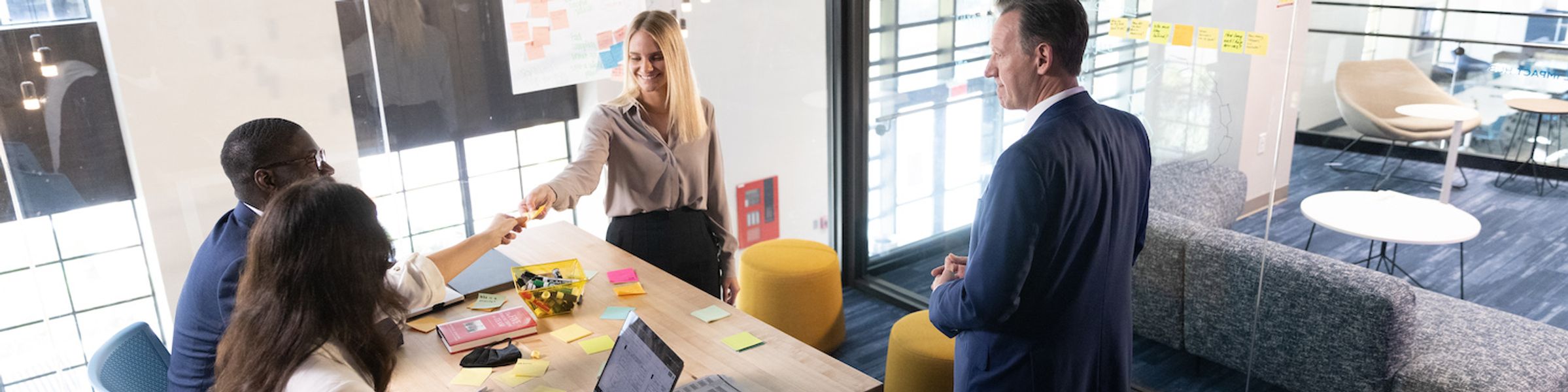 Rollins students work with a mentor in the social impact hub on campus