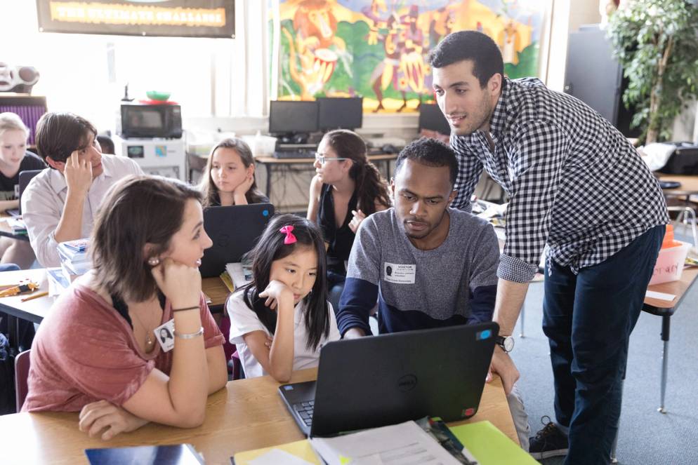 Students in a community engagement course work volunteer with a youth program