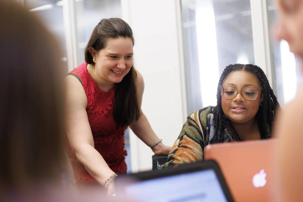 A professor works one on one with a Pathways to Teaching student.