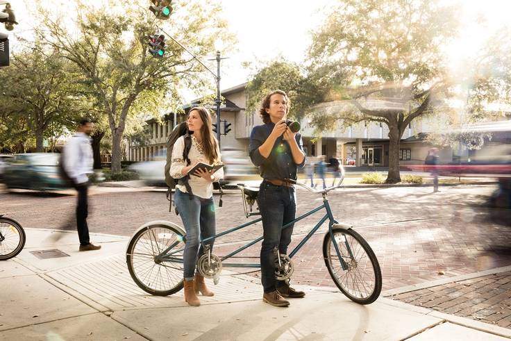 Two Rollins students explore Winter Park on a tandem bike.