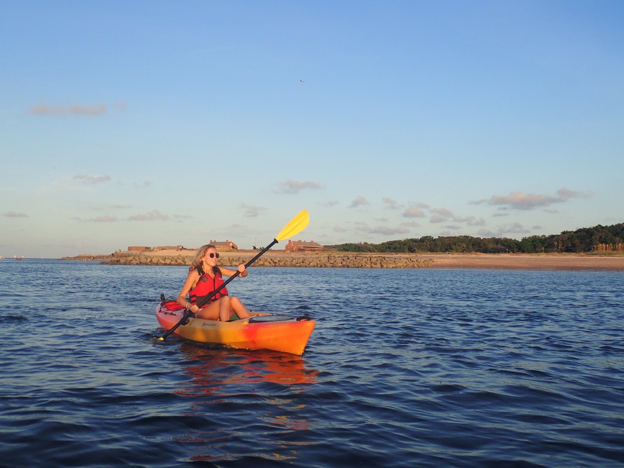 Student kayaking during a community engagement course in South Florida