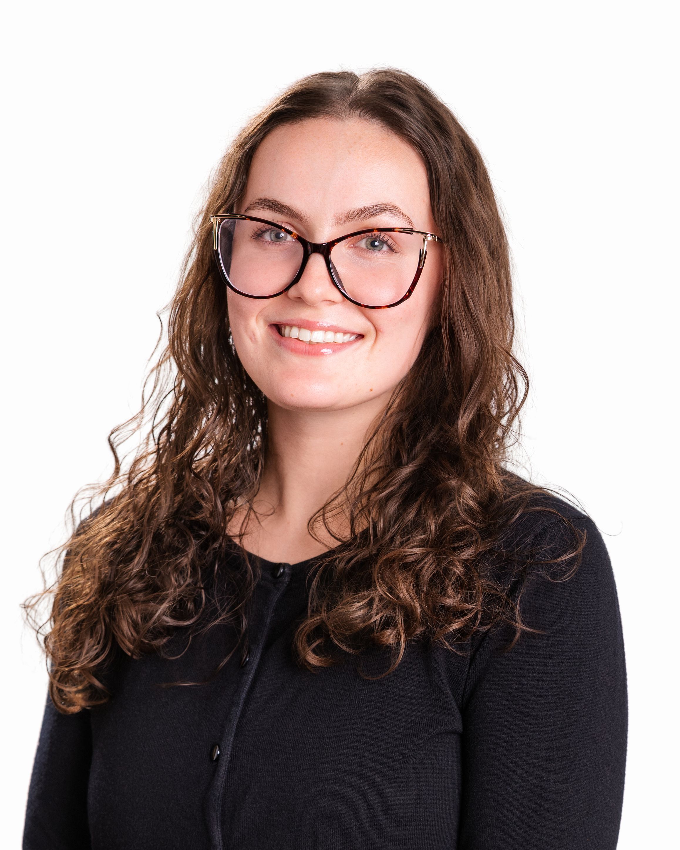 Photo of Brynn in a black long sleeve against white background.