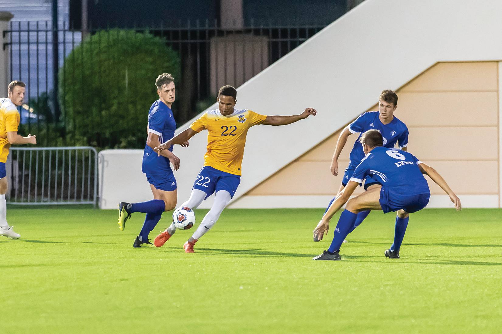 Damian Clarke ’19 playing a soccer game as a midfielder. 