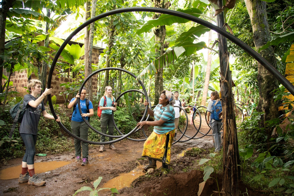 Students working alongside local Tanzanian villagers to build an eco-lodge.