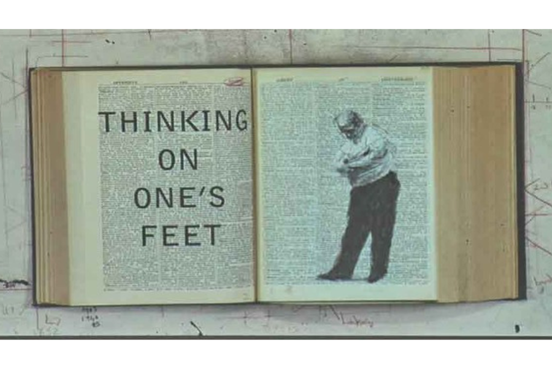 Image of a book open to a page with the words "Thinking on One's Feet" and an illustration of a man standing