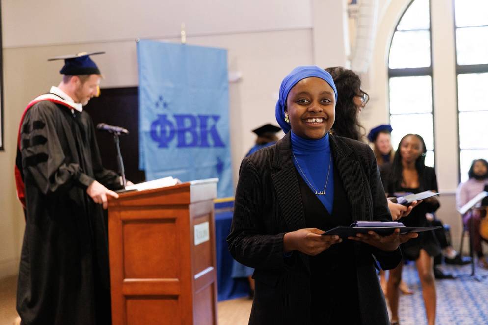 A student being inducted into Phi Beta Kappa at Rollins