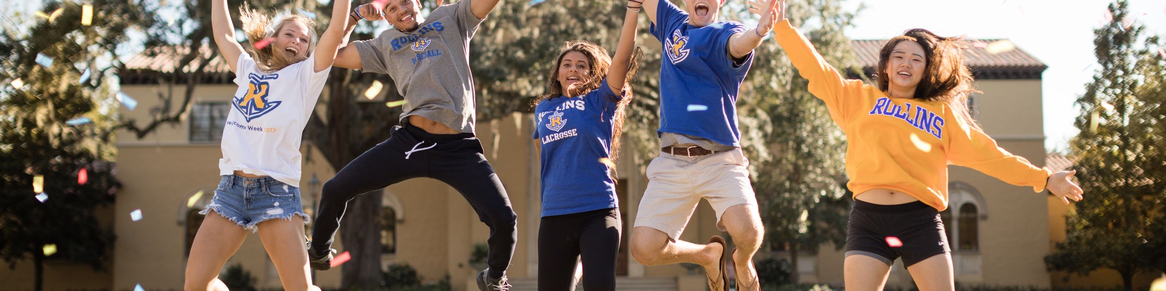 A group of Rollins students celebrate on campus. 