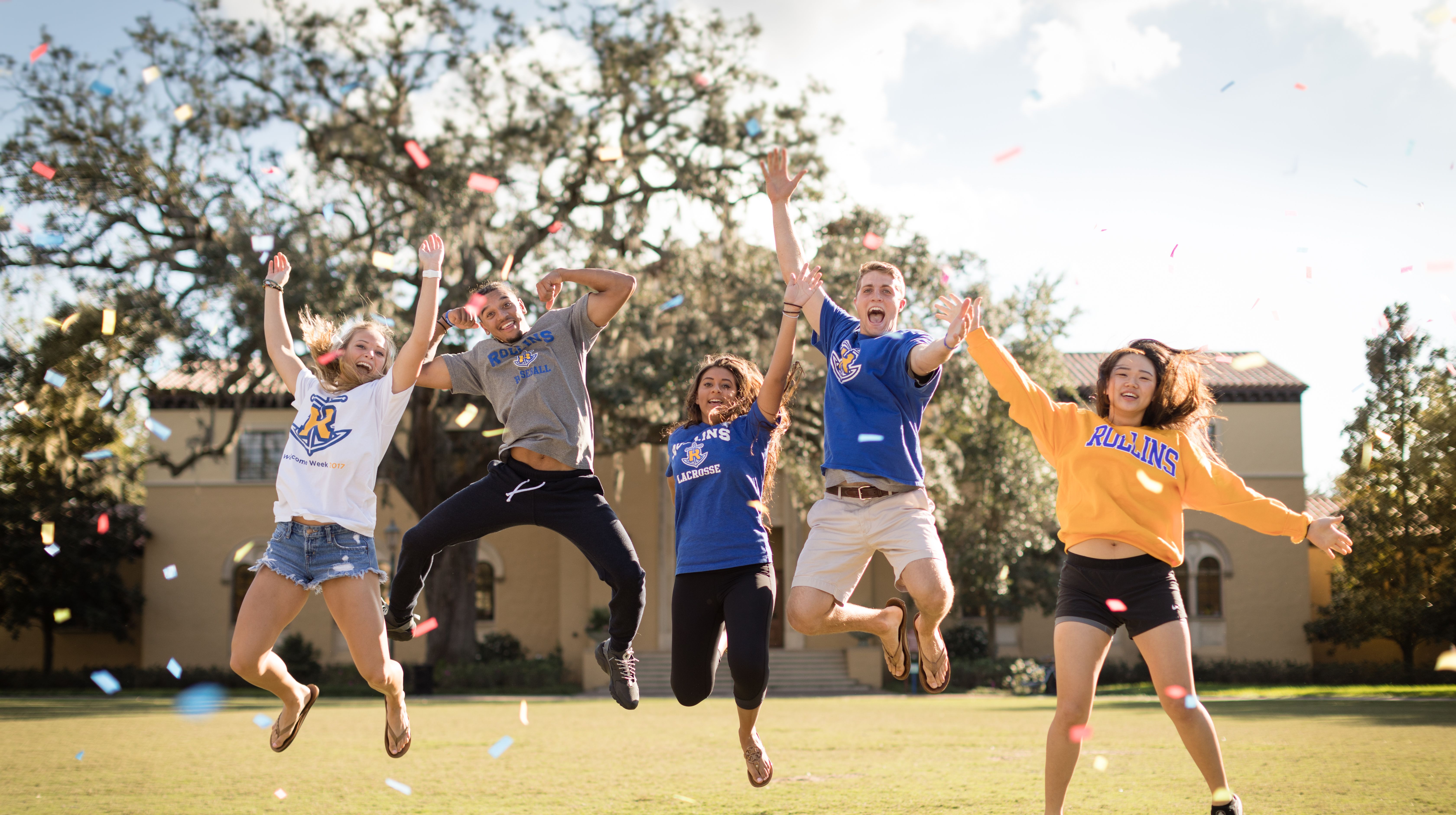 A group of Rollins students celebrate on campus. 