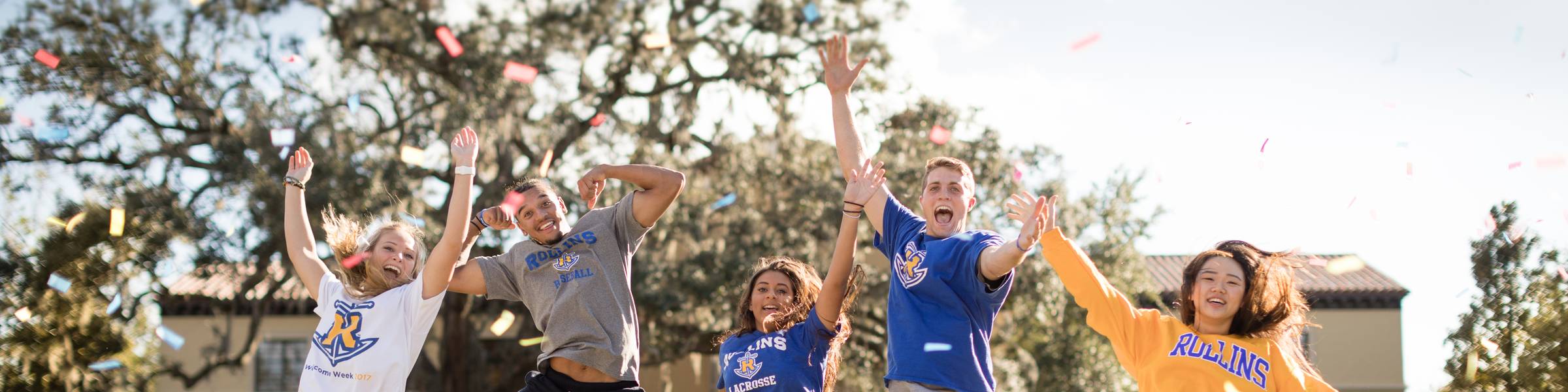 A group of Rollins students celebrate on campus.