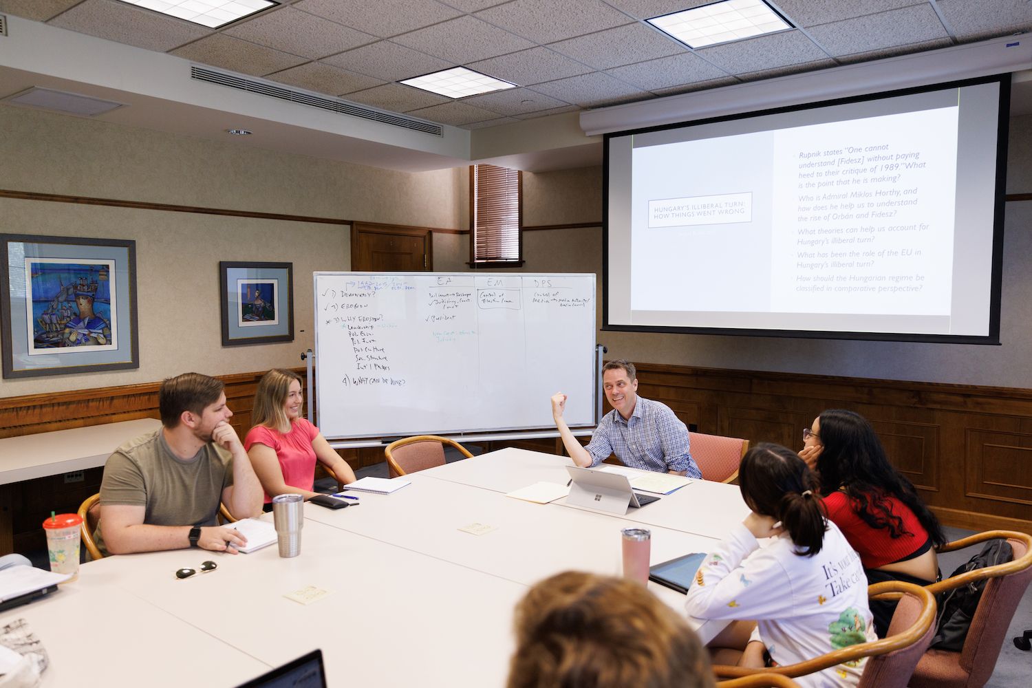 Professor and student have a class discussion.