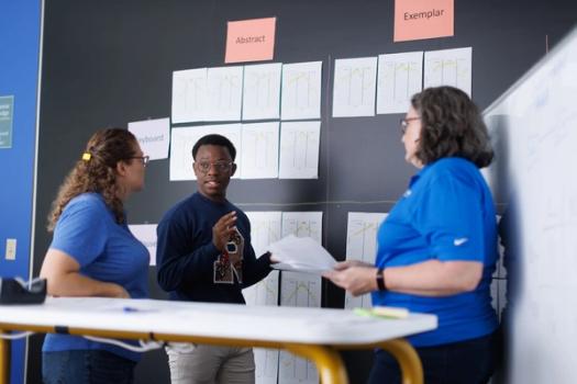 Rollins student and professors work together on a research project.