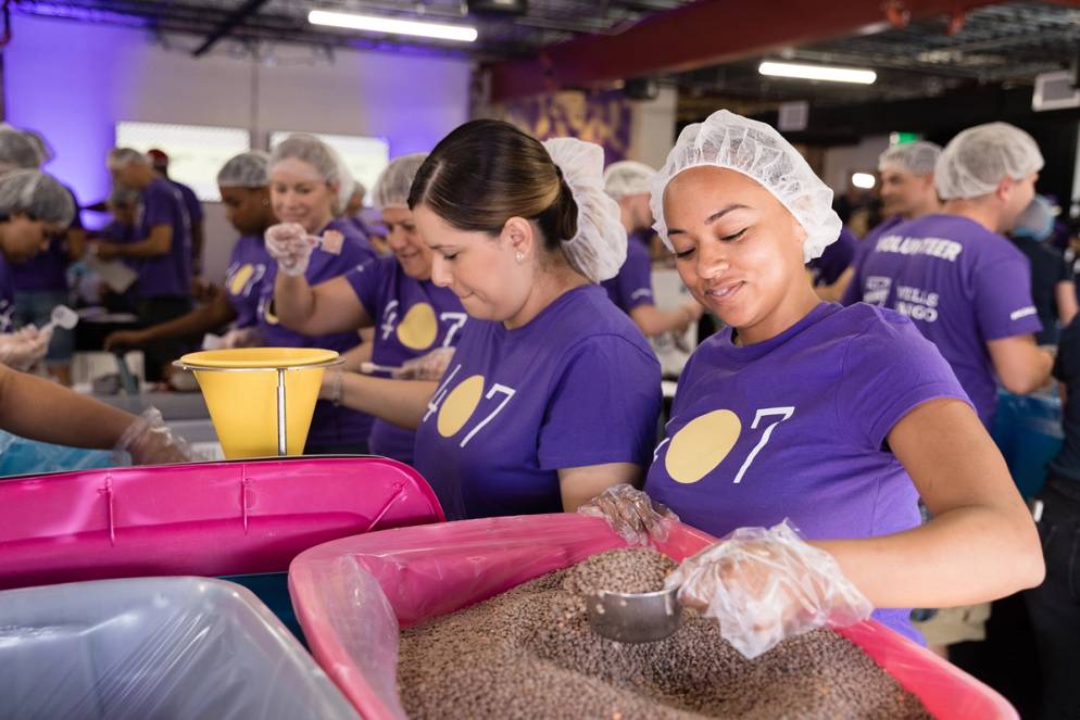 An assembly line builds meal kits.