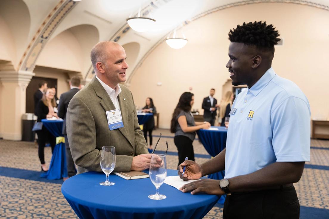 A college student meets with his mentor.