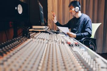 A sound engineer works on a recording.