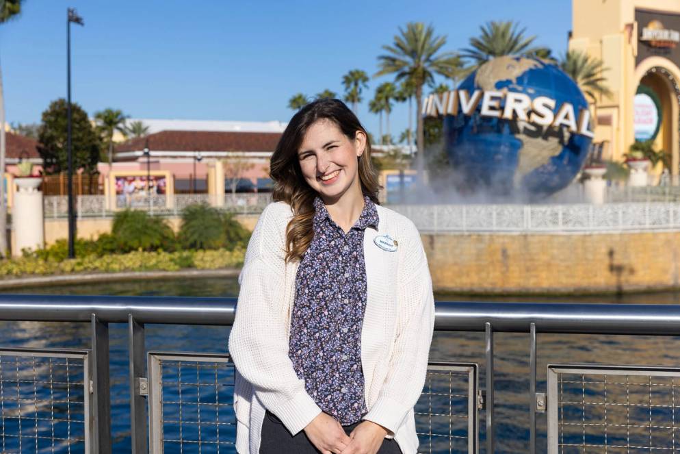 Mariah Haskell, a ride show engineer at Universal Orlando, poses in front of Universal Studios.