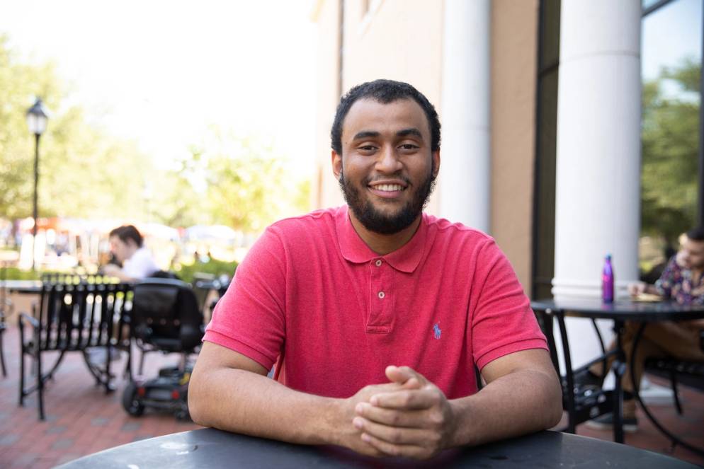 Jonathan Leeper sitting outside at a table.