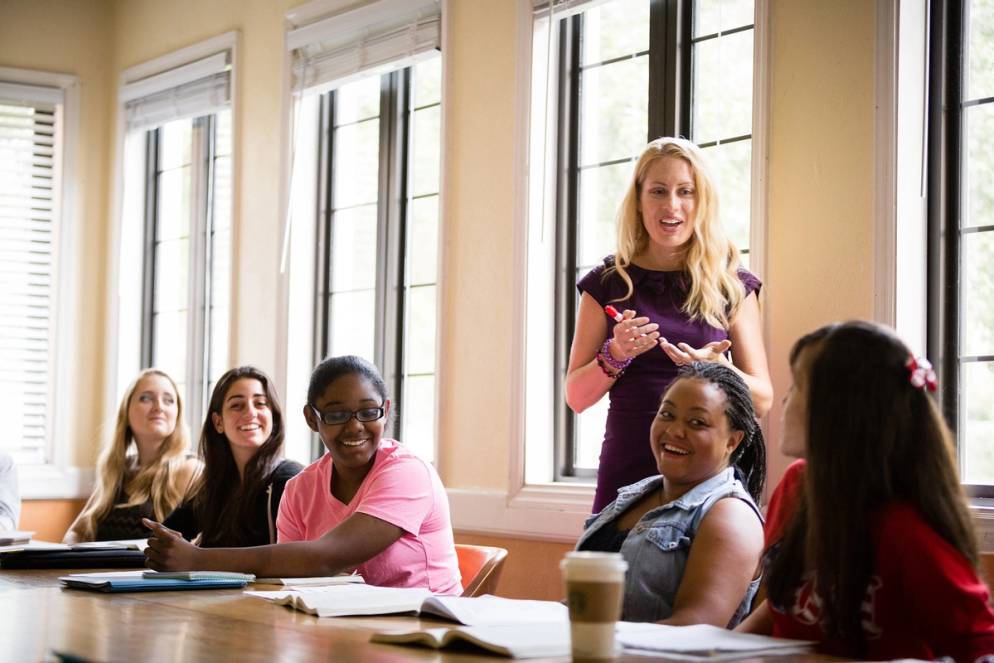 English professor Jana Mathews engaging in class discussion with her students.