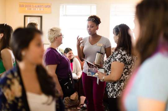 A group of women meet at Rollins’ Lucy Cross Center.