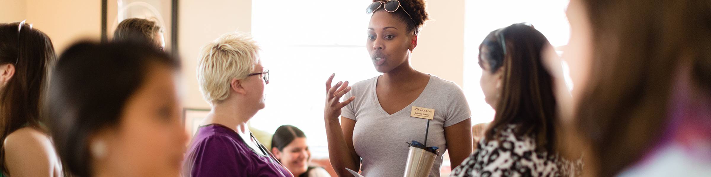 A group of women meet at Rollins’ Lucy Cross Center.