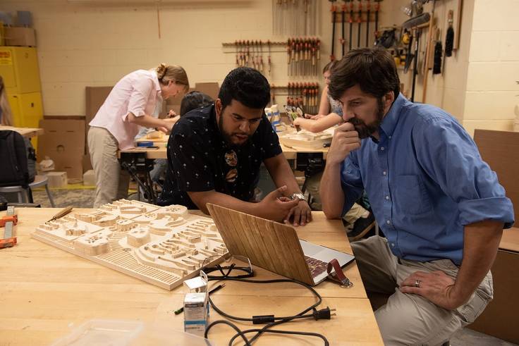 Students work on a project which combines science and art.