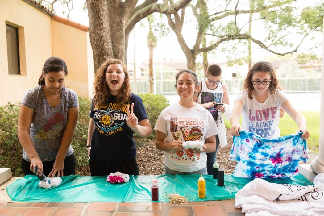 Students make tie-dye shirts.