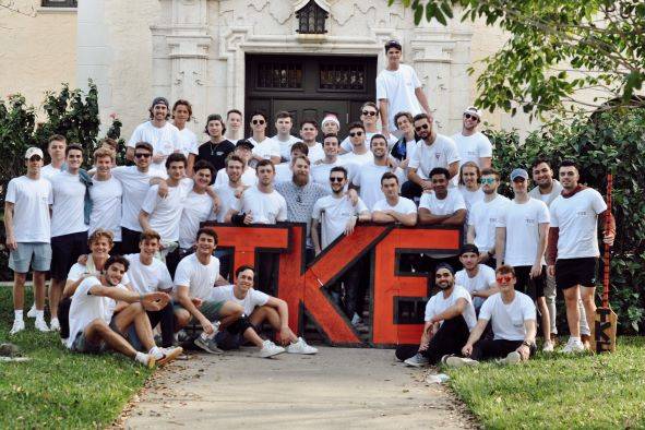 Tau Kappa Epsilon Fraternity brothers standing outside of their residence on Rollins campus.