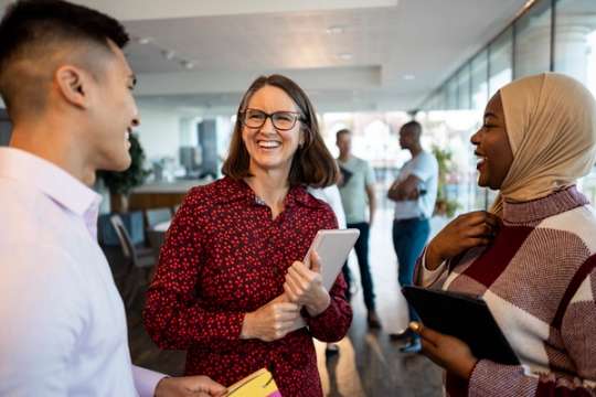 A professional meets with colleagues.