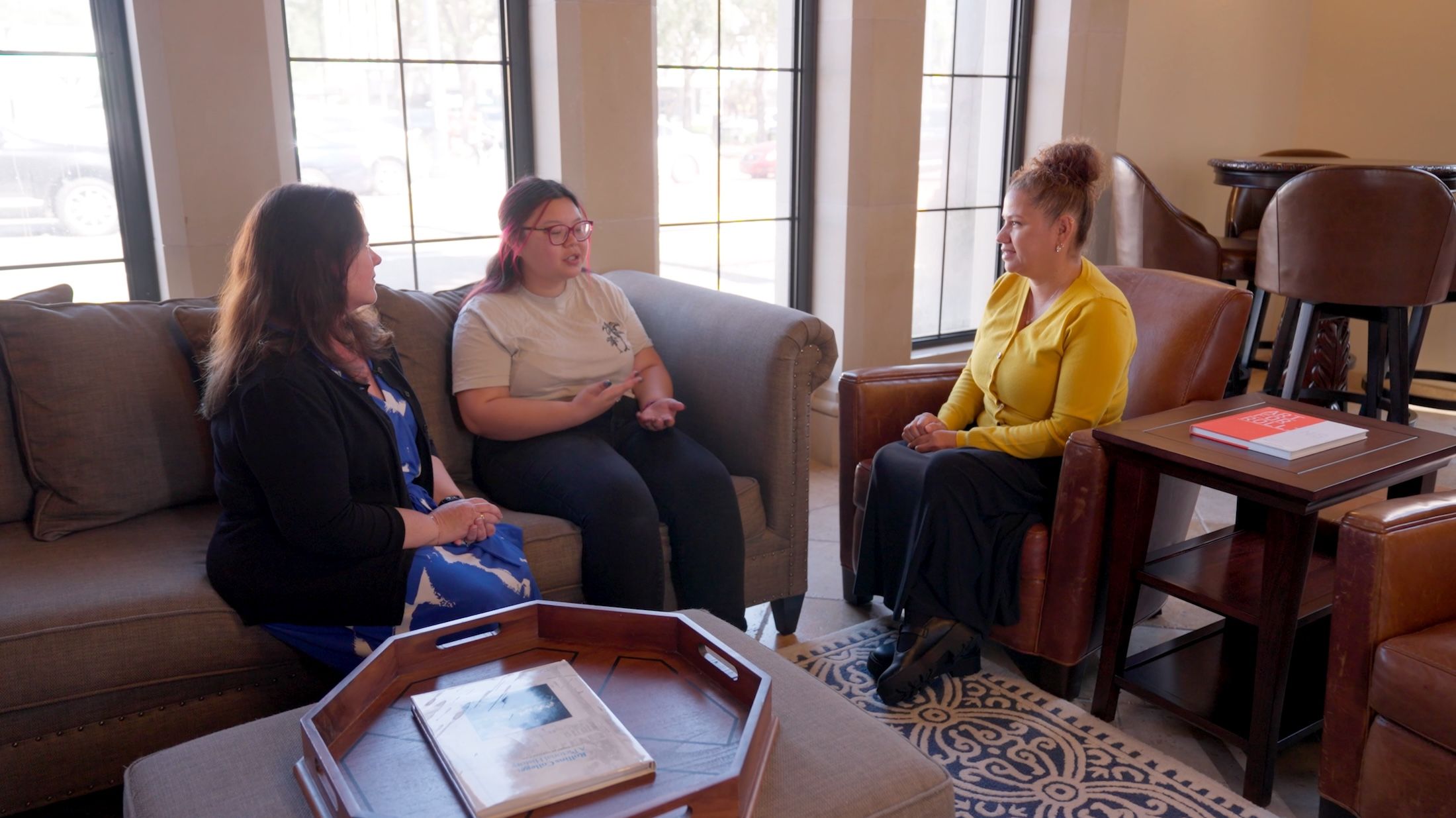 A Rollins admission counselor meets with a prospective student and their mom.