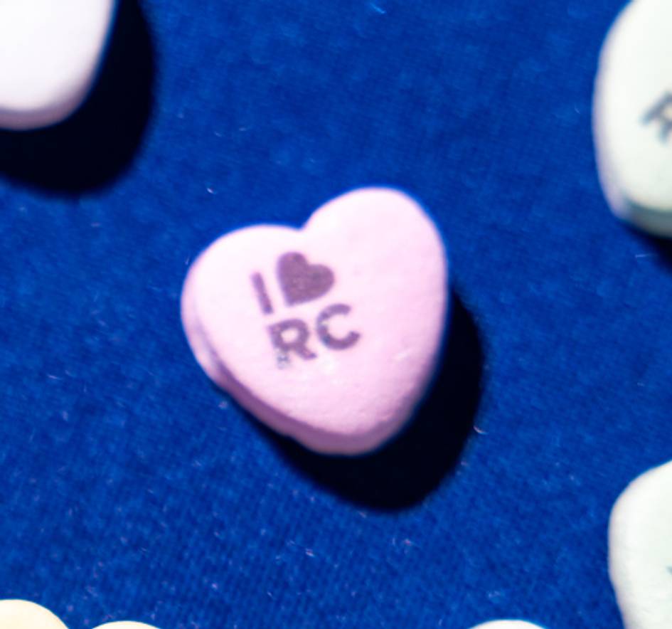 Green candy heart with a fox silhouette on it.