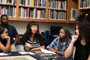 Students having a discussion in the Cornell Fine Arts Museum.
