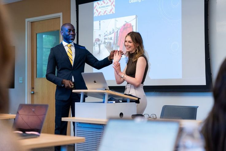 Hayley Stoddard ’24 with business professor Emmanuel Kodzi