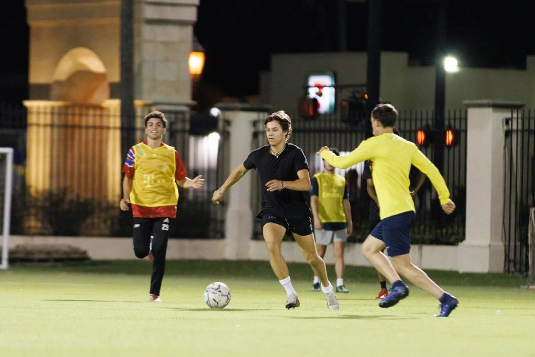 Students play intramural soccer on Sandspur Field.