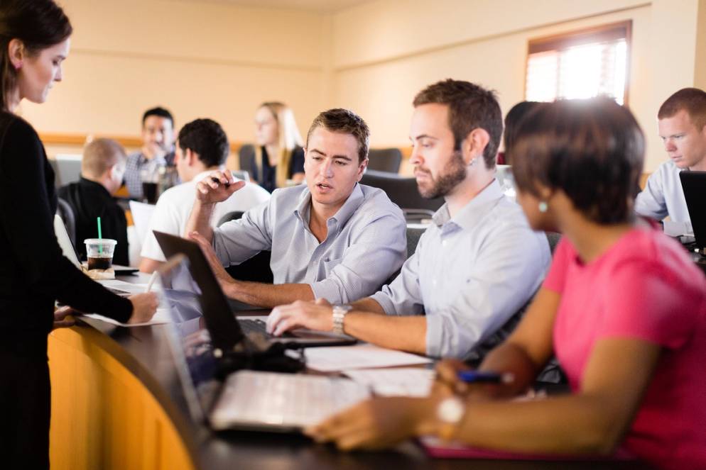 Crummer of Graduate Business School students collaborate on a project.