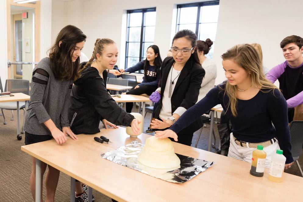 Chemistry professor Ellane Park gives a hands-on lesson to her students about polymers and catalysts.