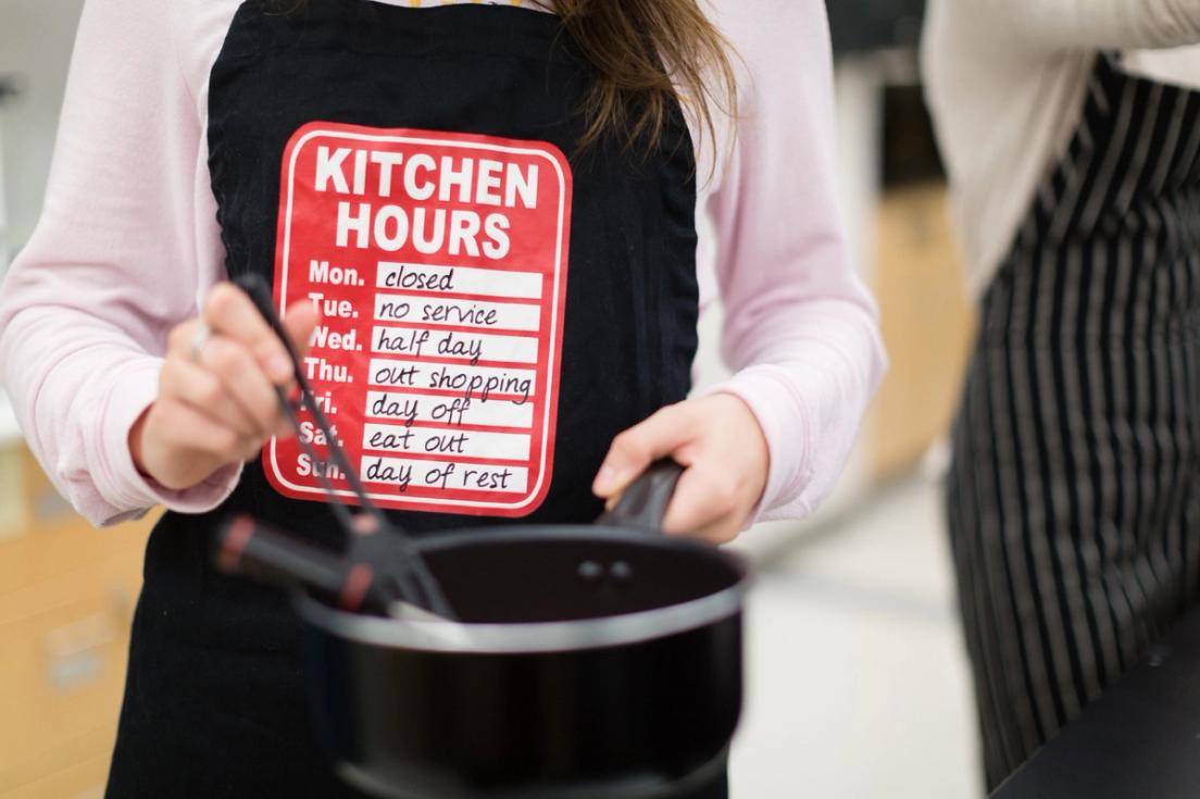 A student stirs a pot of gelatin.