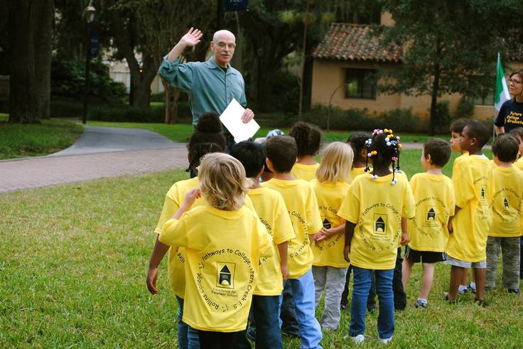 Math professor Jay Yellen and a group of underserved elementary school students.