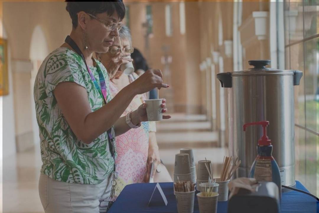  two people drinking coffee
