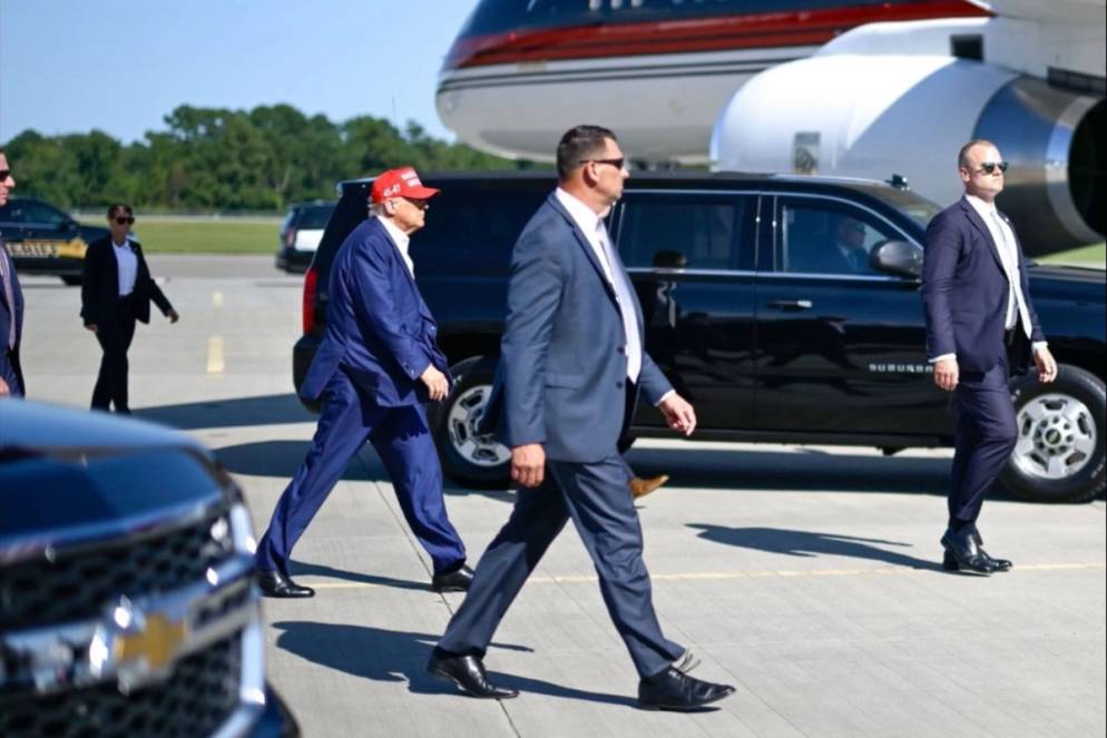 Kyle Davis walking ahead of President Donald J. Trump