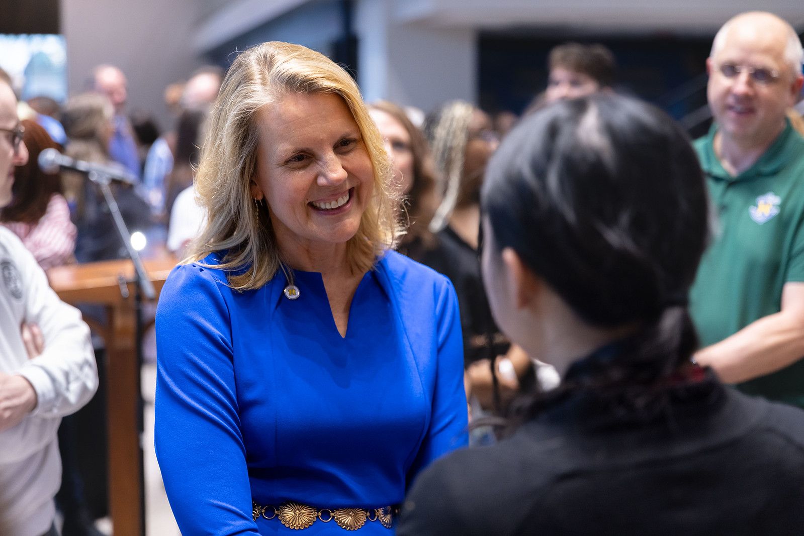 President Brooke Barnett engages in a warm conversation with a student during a Rollins event.