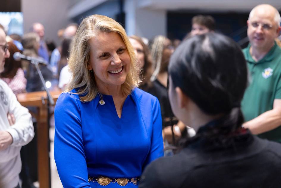 President Brooke Barnett chats one on one with a student.