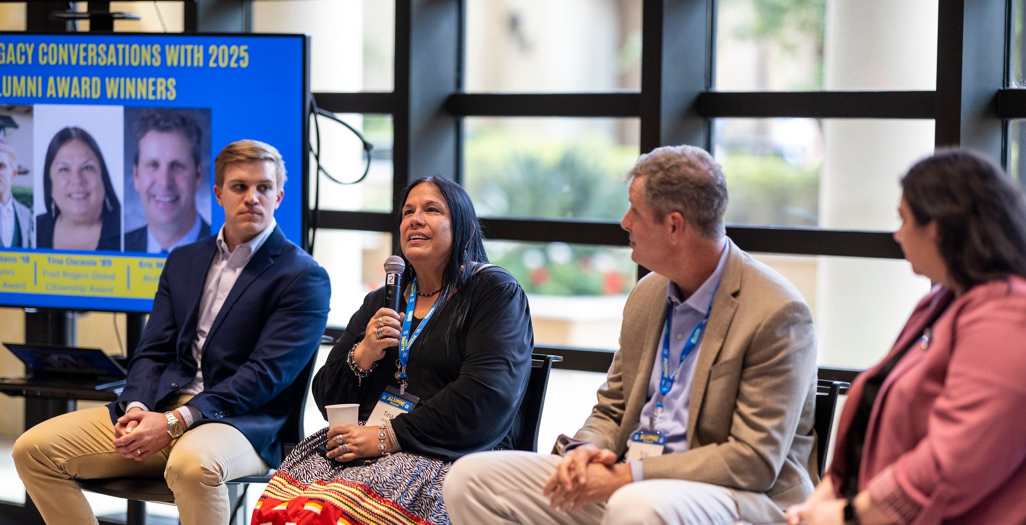 A panel of alumni speakers during an event.