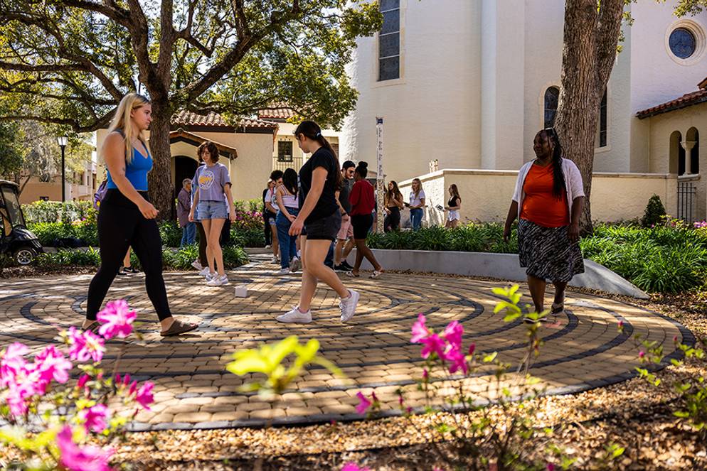 Rollins students walking the labyrinth path